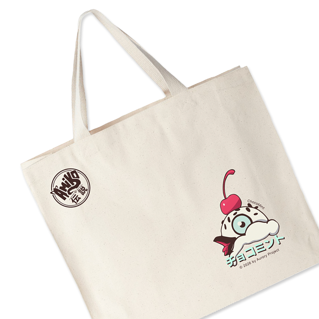 An off-white canvas tote bag with two shoulder straps, featuring a circular black logo on the upper left and a Amiko Legends character.
